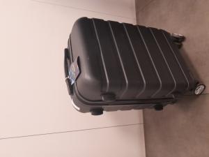EMPTY TROLLEY LUGGAGE WITH TAG REPORTING NAME ANDRU