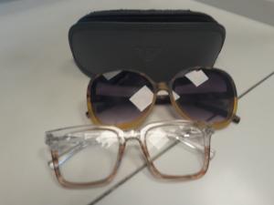 Eyeglasses, two pairs in grey case