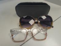 Eyeglasses, two pairs in grey case